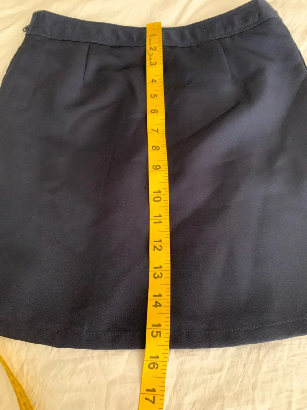 Navy Pleated Mini Skirt with Side Buckle Detail